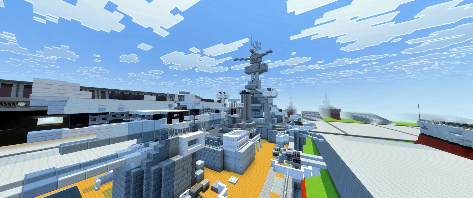 Deck-level view up into Arkansas's refit tower structure, with other builds visible in the background.